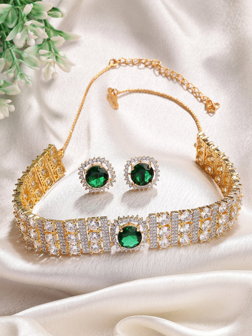 Sukkhi Eye Catchy Gold Plated Cubic Zirconia Studded Emerald Green Brass Choker Necklace with Studs Earrings Jewellery Set for Women