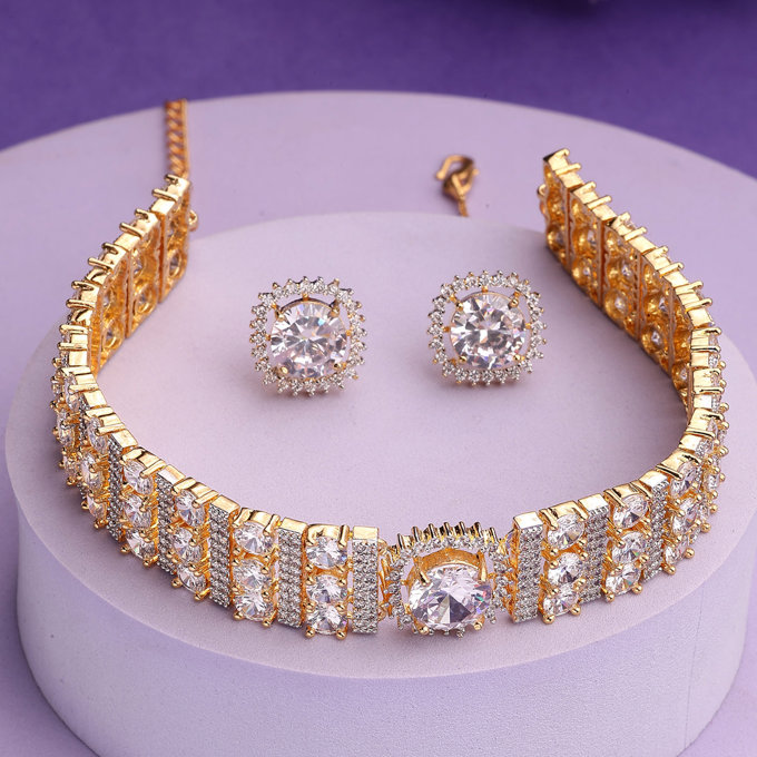 Sukkhi Attractive Gold Plated Cubic Zirconia Studded White Brass Choker Necklace with Studs Earrings Jewellery Set for Women