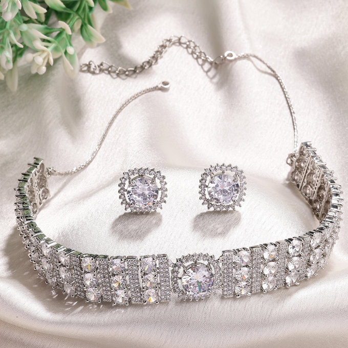 Sukkhi Decent Stylish Design Rhodium Plated Cubic Zirconia Studded White Brass Choker Necklace with Studs Earrings Jewellery Set for Women