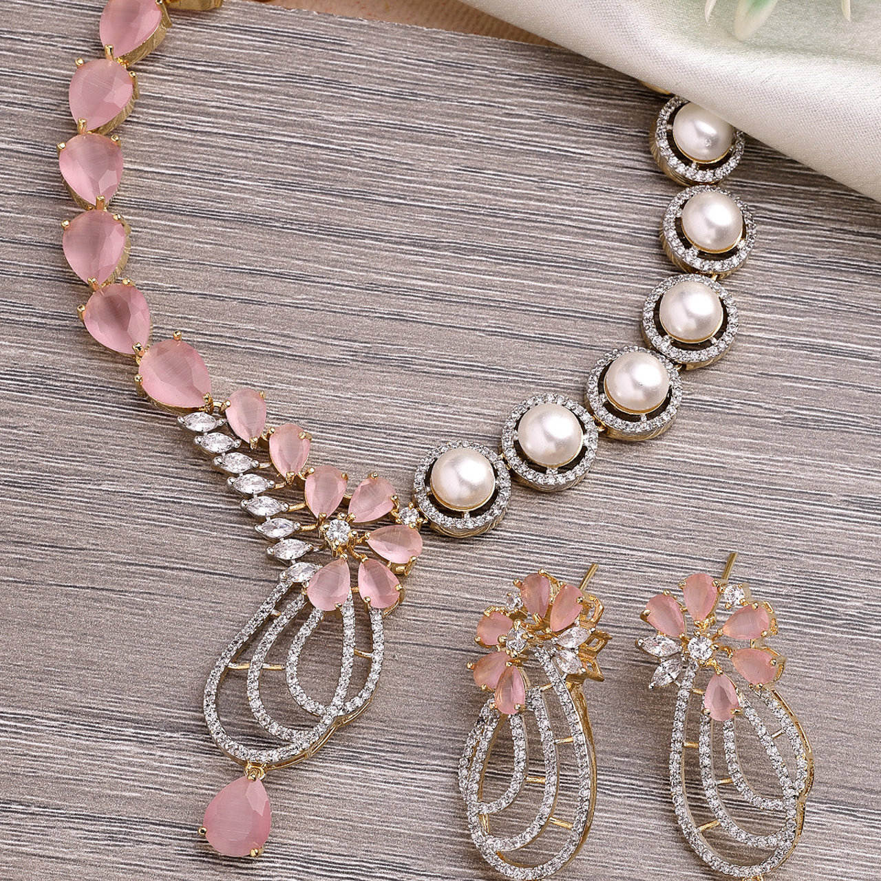 Sukkhi Pretty Pink Tear Drop Round Design Gold Plated Cubic Zirconia & Pearl Studded Brass Collar Necklace with Drop Earrings Jewellery Set for Women