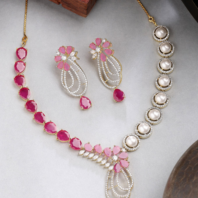 Sukkhi Beautiful Red Tear Drop Round Design Gold Plated Cubic Zirconia & Pearl Studded Brass Collar Necklace with Drop Earrings Jewellery Set for Women