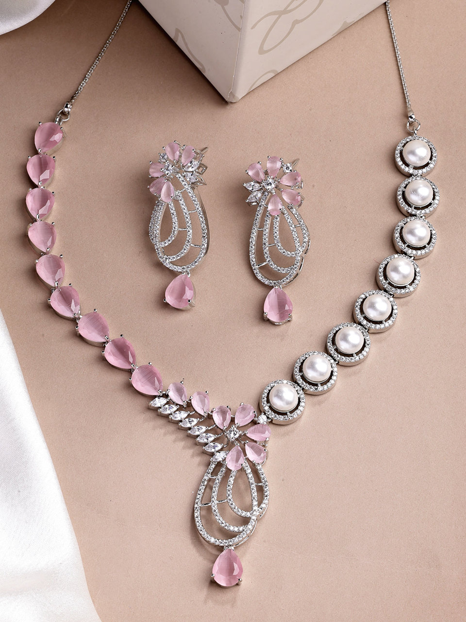 Sukkhi Pretty Pink Tear Drop Round Design Rhodium Plated Cubic Zirconia & Pearl Studded Brass Collar Necklace & Drop Earrings Jewellery Set for Women