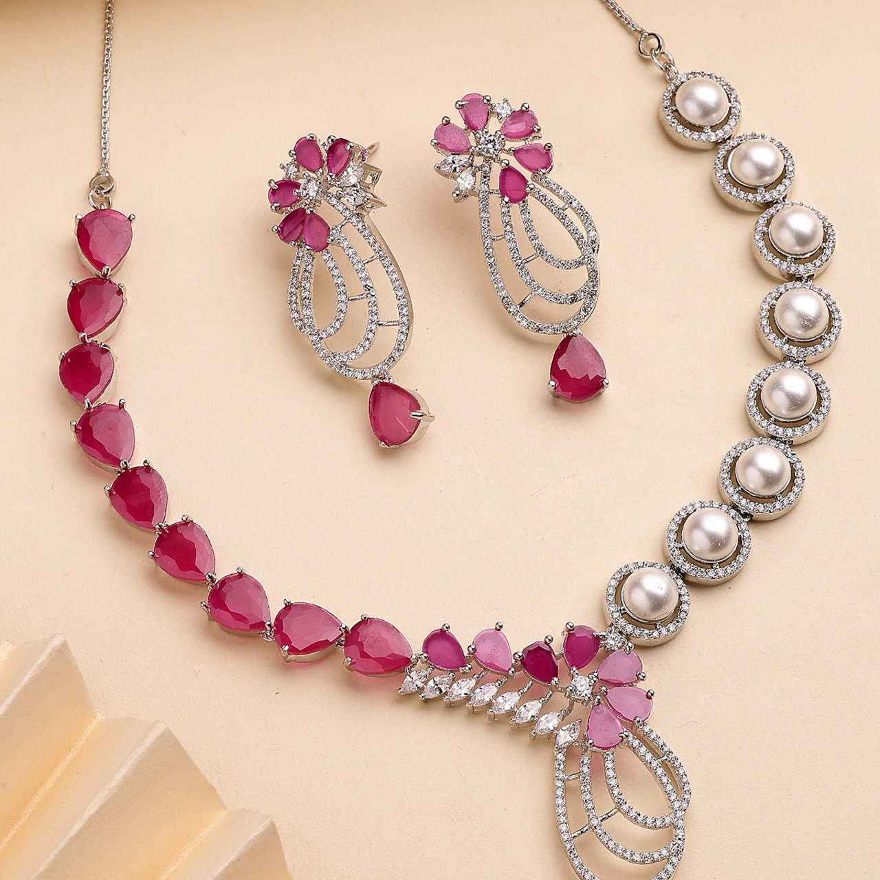 Sukkhi Red Cherry Tear Drop Round Design Rhodium Plated Cubic Zirconia & Pearl Studded Brass Collar Necklace with Drop Earrings Jewellery Set for Women