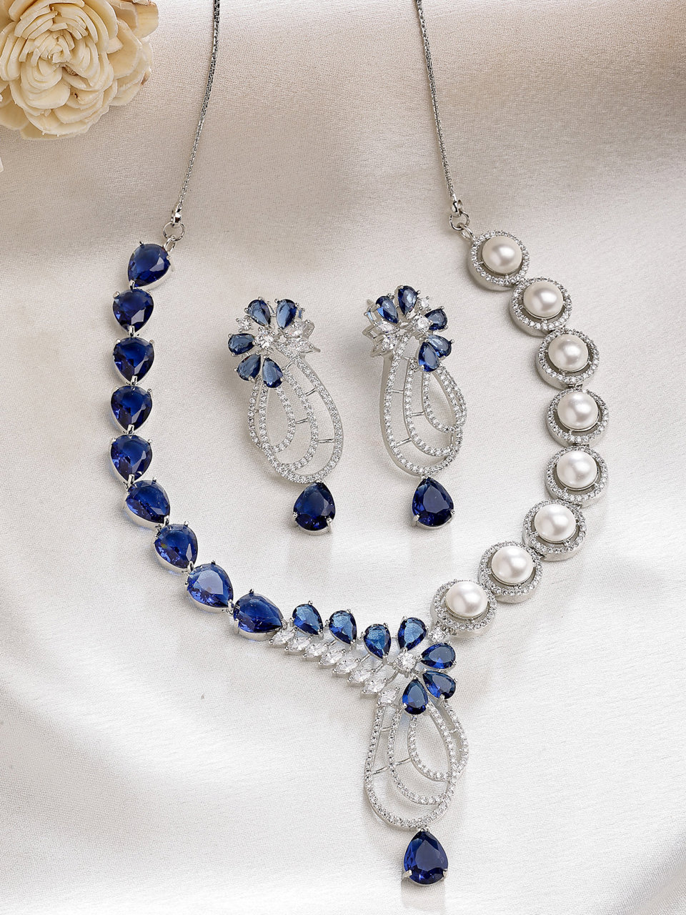 Sukkhi Classic Tear Drop Round Design Rhodium Plated Cubic Zirconia & Pearl Studded Blue Brass Collar Necklace & Drop Earrings Jewellery Set for Women