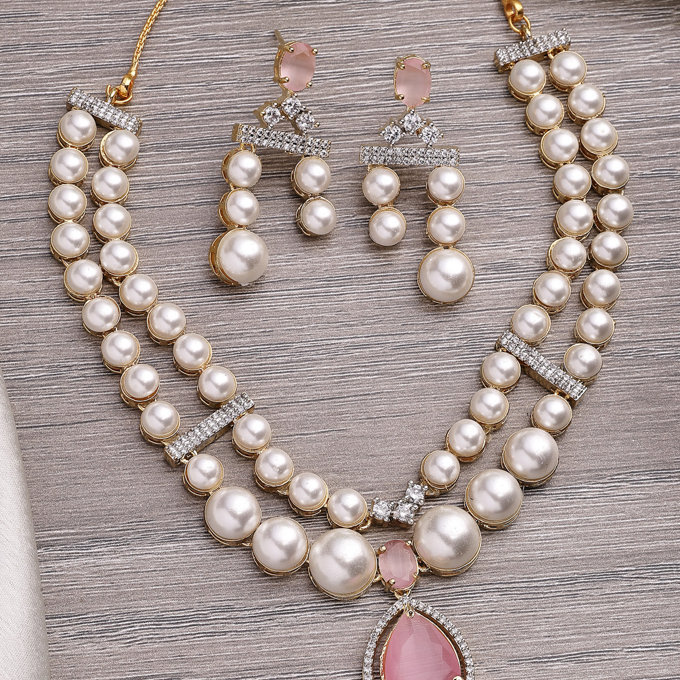 Sukkhi Beautiful Pink Pear Design Gold Plated Cubic Zirconia & Pearl Studded Brass Two Layered Collar Necklace & Drop Earrings Jewellery Set for Women