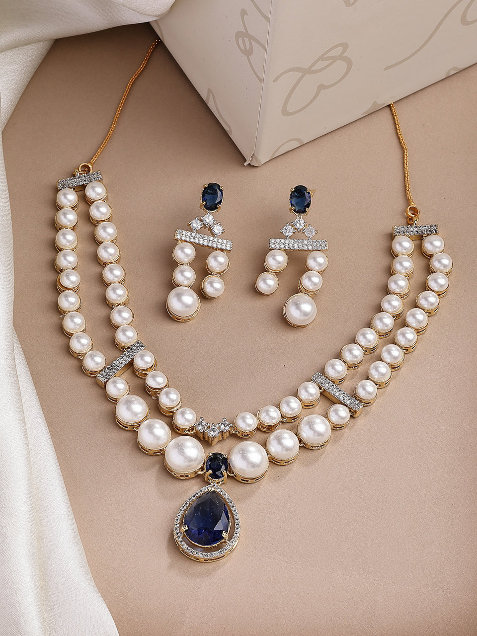 Sukkhi Glamorous Blue Pear Design Gold Plated CZ & Pearl Studded Brass Two Layered Collar Necklace with Drop Earrings Jewellery Set for Women