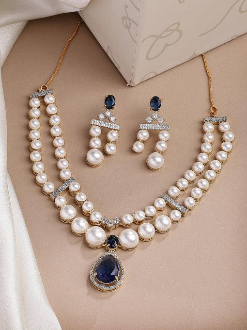 Sukkhi Glamorous Blue Pear Design Gold Plated CZ & Pearl Studded Brass Two Layered Collar Necklace with Drop Earrings Jewellery Set for Women