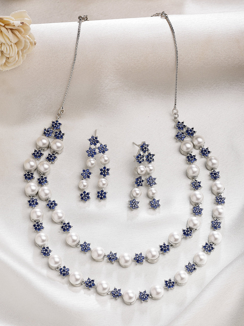 Sukkhi Desirable Blue Floral Design Rhodium Plated with CZ & Pearl Studded Brass Two Layered Collar Necklace with Drop Earrings Jewellery Set for Women