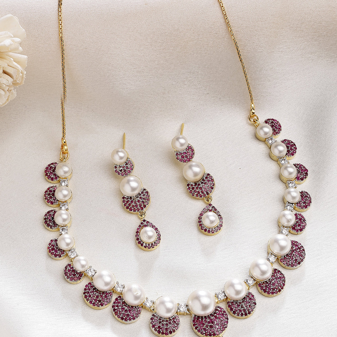 Sukkhi Sparkling Round Design Gold Plated with Cubic Zirconia & Pearl Studded Red Brass Collar Necklace with Drop Earrings Jewellery Set for Women