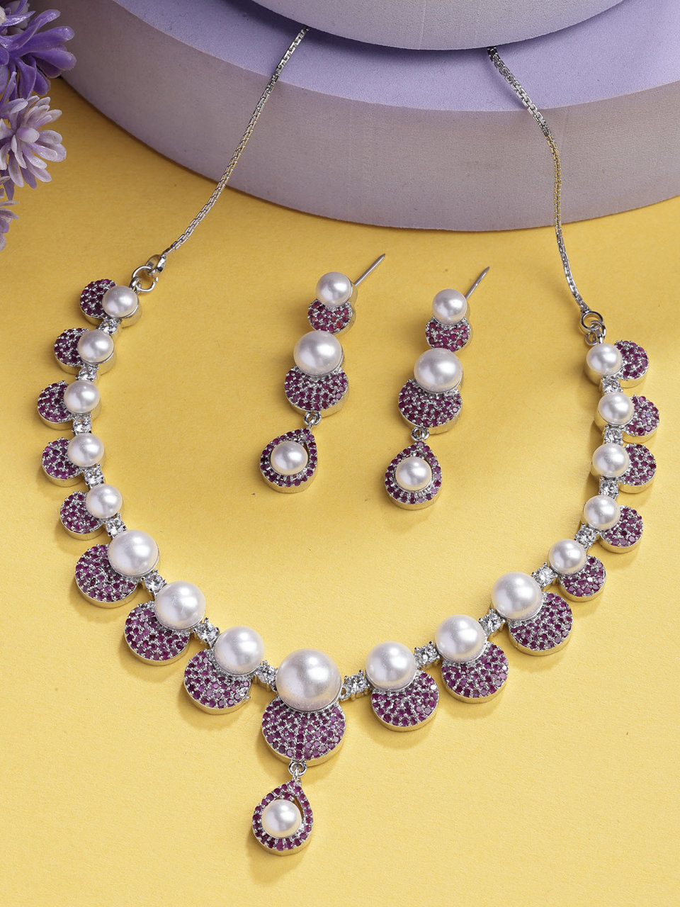 Sukkhi Flawless Round Design Rhodium Plated with Cubic Zirconia & Pearl Studded Red Brass Collar Necklace with Drop Earrings Jewellery Set for Women