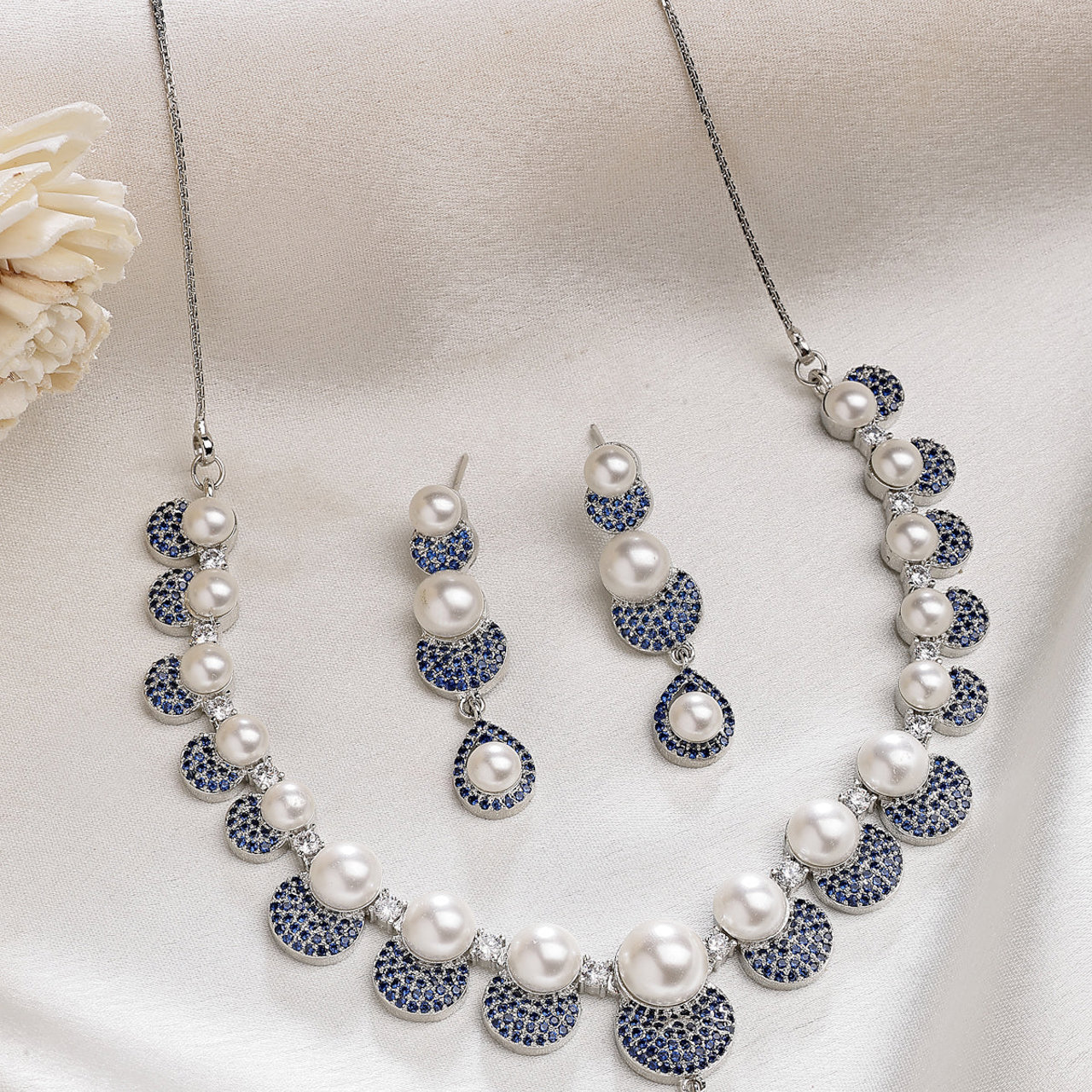 Sukkhi Smart Round Design Rhodium Plated with Cubic Zirconia & Pearl Studded Blue Brass Collar Necklace with Drop Earrings Jewellery Set for Women
