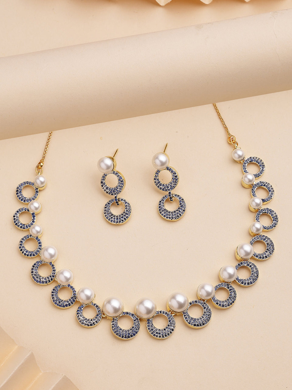 Sukkhi Modern Round Design Gold Plated with Cubic Zirconia & Pearl Studded Blue Brass Collar Necklace with Drop Earrings Jewellery Set for Women