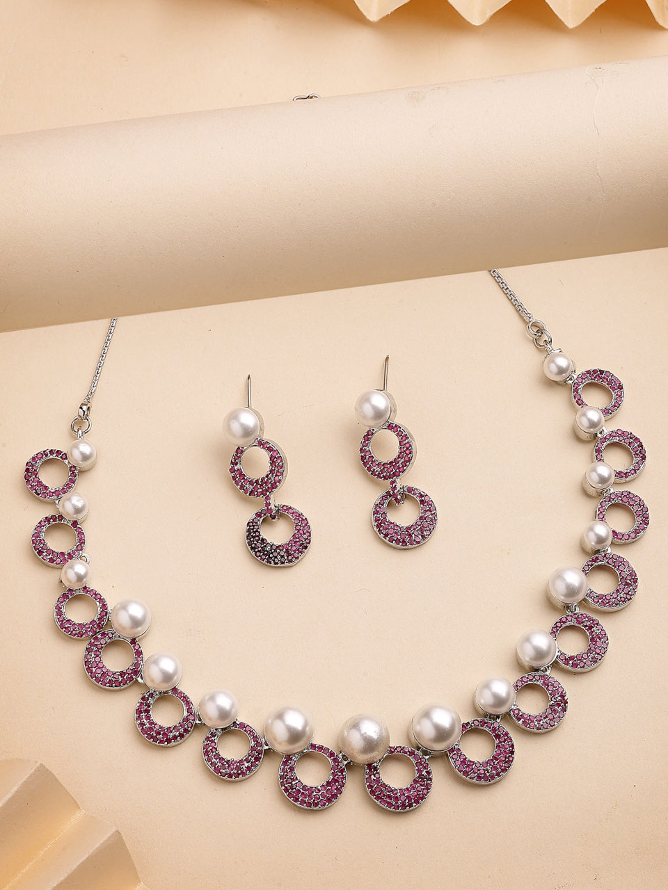 Sukkhi External Stylish Rhodium Plated with Cubic Zirconia & Pearl Studded Red Brass Collar Necklace with Drop Earrings Jewellery Set for Women