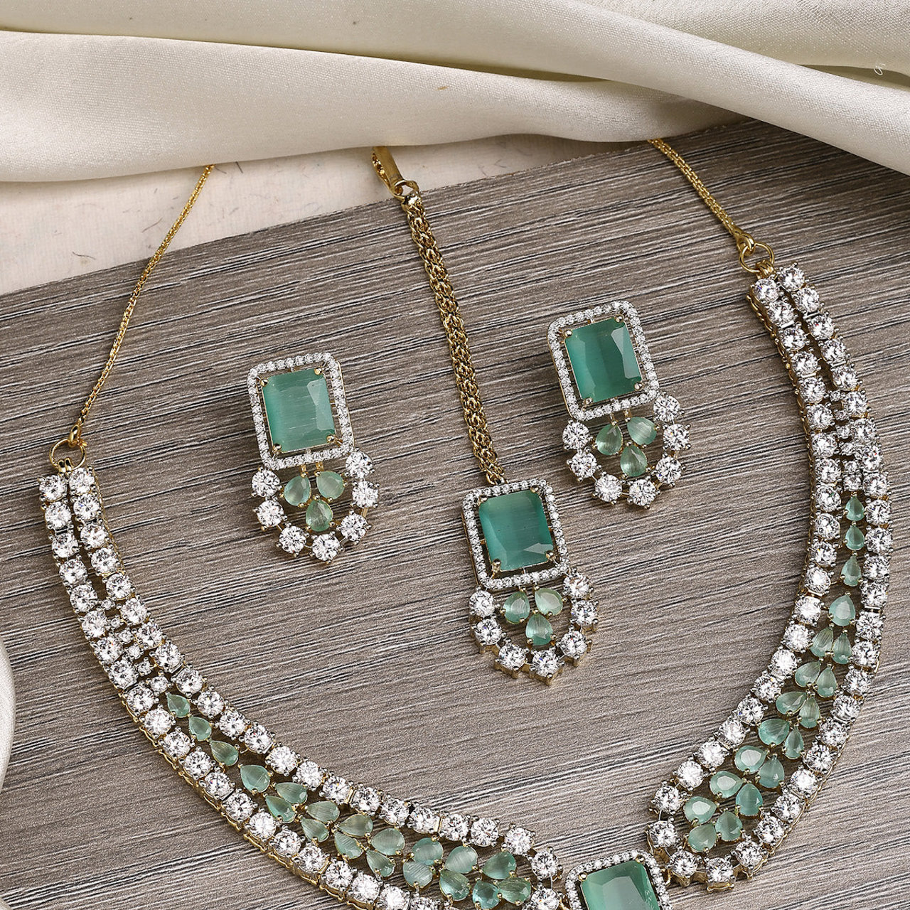Sukkhi Beautiful Gold Plated with Cubic Zirconia Studded Brass Mint Green Collar Necklace with Studs Earring & Maangtikka Jewellery Set for Women