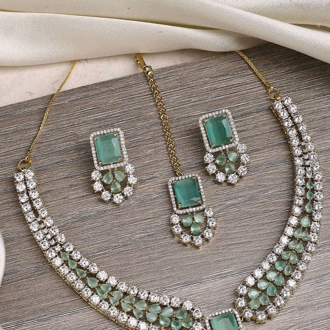 Sukkhi Beautiful Gold Plated with Cubic Zirconia Studded Brass Mint Green Collar Necklace with Studs Earring & Maangtikka Jewellery Set for Women