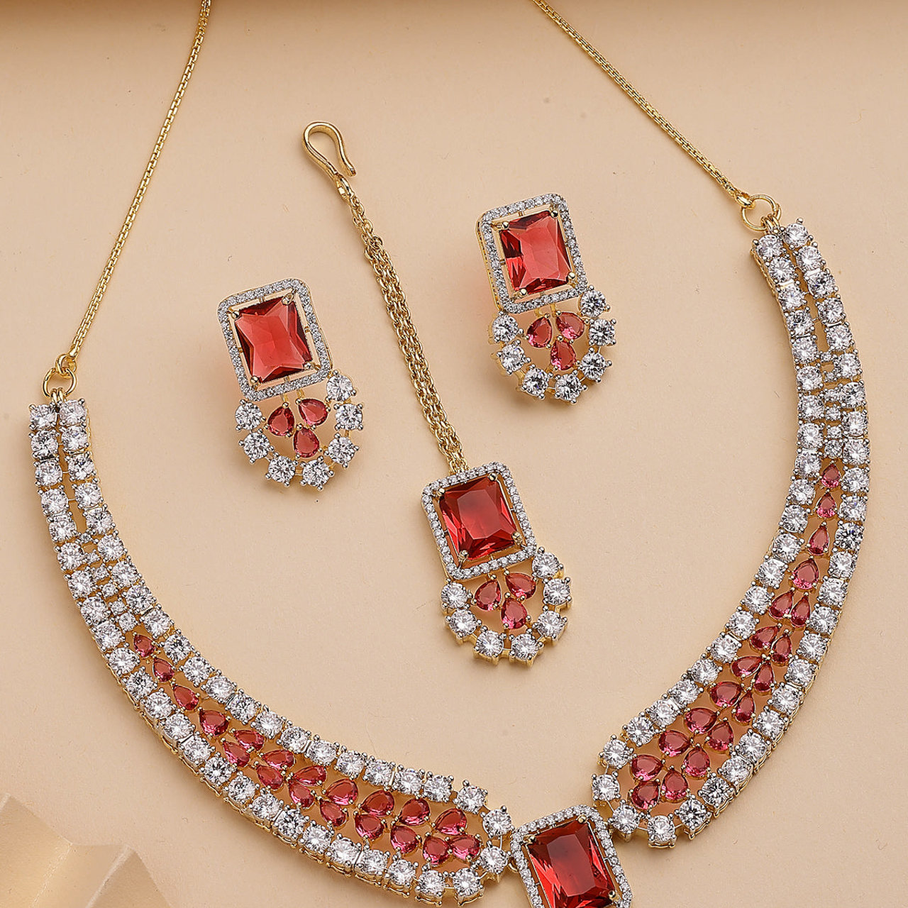Sukkhi Unique Stylish & Designable Gold Plated Cubic Zirconia Studded Brass Red Collar Necklace with Studs Earring & Maangtikka Jewellery Set for Women