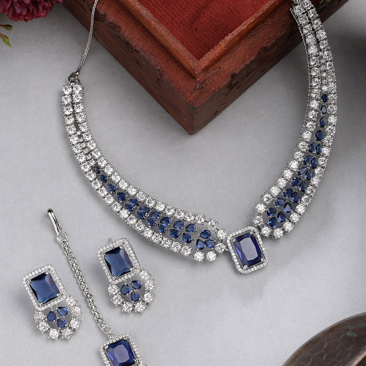 Sukkhi Royal Blue Fashionable Rhodium Plated Cubic Zirconia Studded Brass Collar Necklace with Studs Earring & Maangtikka Jewellery Set for Women