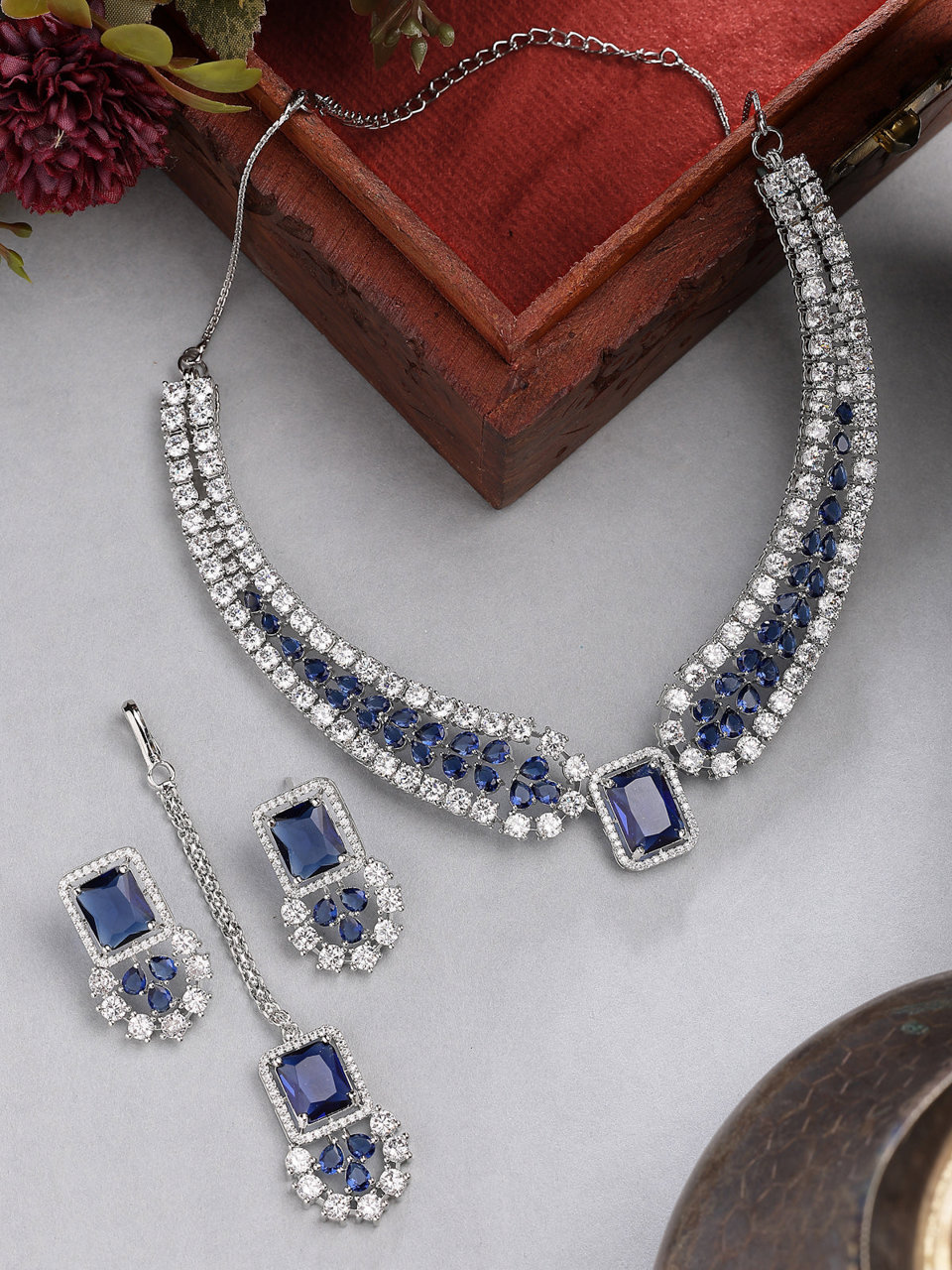 Sukkhi Royal Blue Fashionable Rhodium Plated Cubic Zirconia Studded Brass Collar Necklace with Studs Earring & Maangtikka Jewellery Set for Women