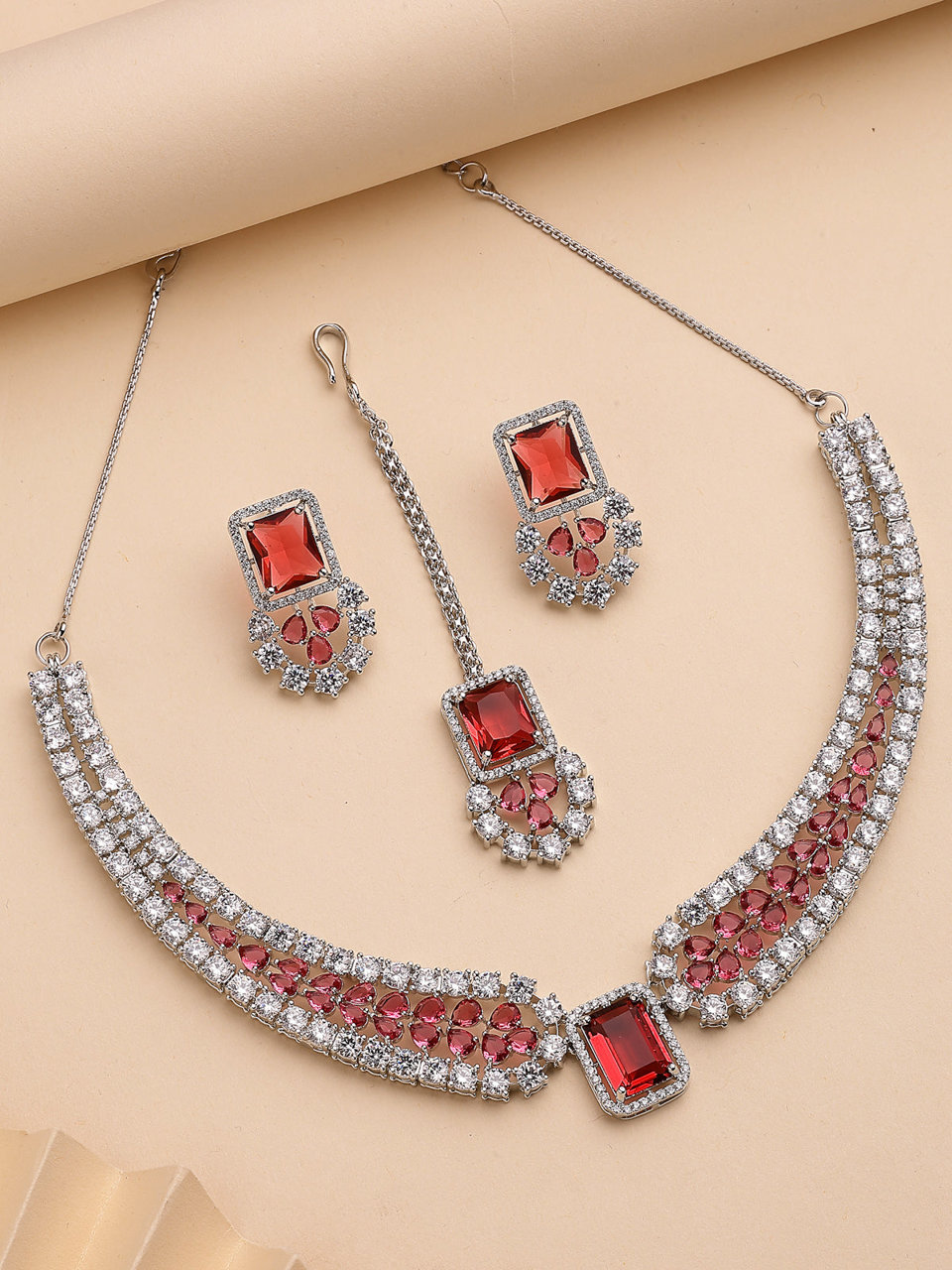 Sukkhi Charming Fashionable Rhodium Plated Red Cubic Zirconia Studded Brass Collar Necklace with Studs Earring & Maangtikka Jewellery Set for Women
