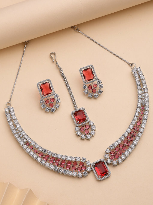 Sukkhi Charming Fashionable Rhodium Plated Red Cubic Zirconia Studded Brass Collar Necklace with Studs Earring & Maangtikka Jewellery Set for Women