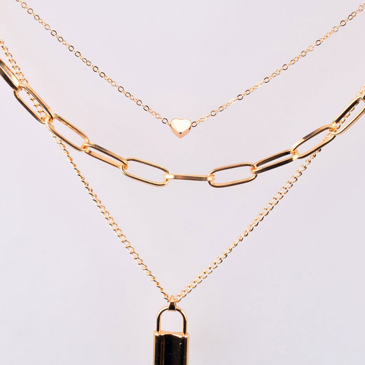 Scintillare by Sukkhi Modish Gold Plated Multi Layered Heart Lock Necklace for Women